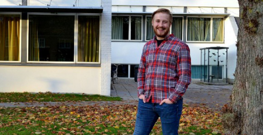 Marcus standing outside smiling